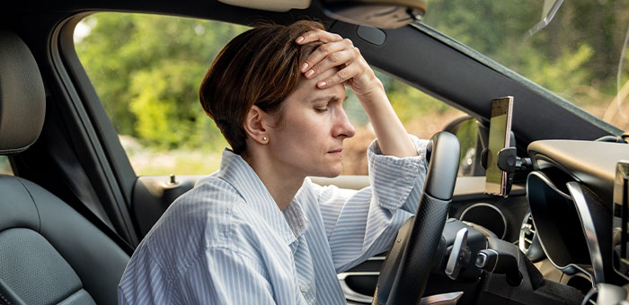 patient with headaches needing auto accident chiropractor in Plano