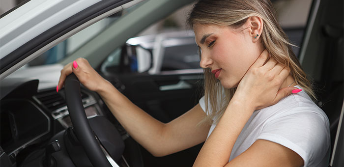 patient with neck pain needing auto accident chiropractor in Plano