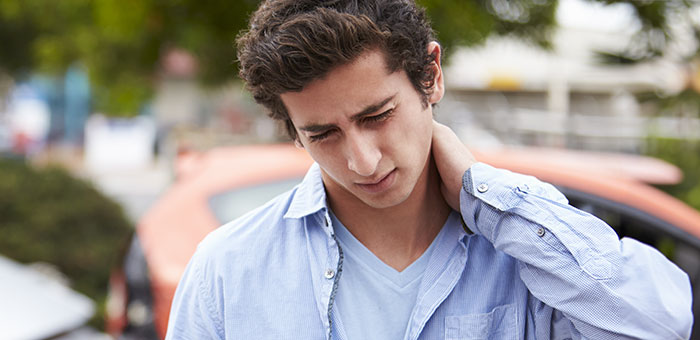 patient with pinched nerve needing auto accident chiropractor in Plano