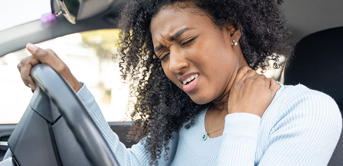 patient with whiplash needing auto accident chiropractor in Plano